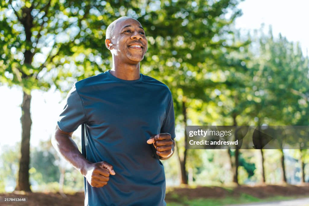 Portrait of a mature man running in the public park