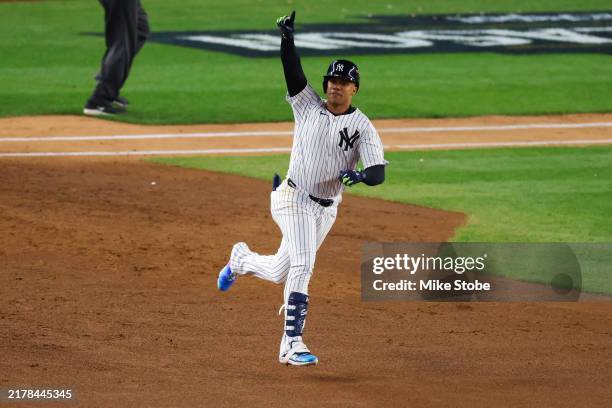 Juan Soto of the New York Yankees rounds the bases after hitting a home run during the 3rd inning of Game One of the American League Championship...