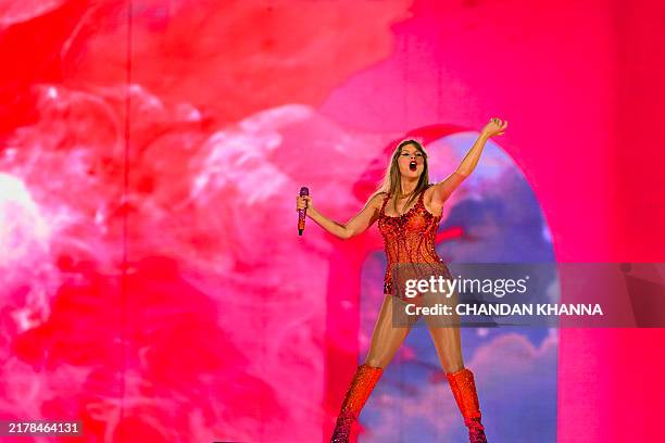Singer Taylor Swift performs on stage during "The Eras Tour" at the Hard Rock stadium in Miami Gardens, Florida, October 18, 2024. / RESTRICTED TO...