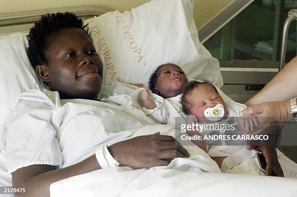 Sheila, a sub-Saharian woman who illegally arrived 17 July 2003 in Tarifa poses at the hospital with her two new born babies. Pregnant immigrants...