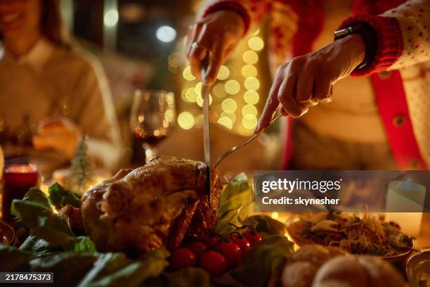 cutting christmas roasted chicken! - stuffed turkey stock pictures, royalty-free photos & images