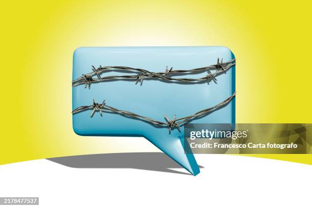 speech bubble wrapped in barbed wire - censorship stock pictures, royalty-free photos & images