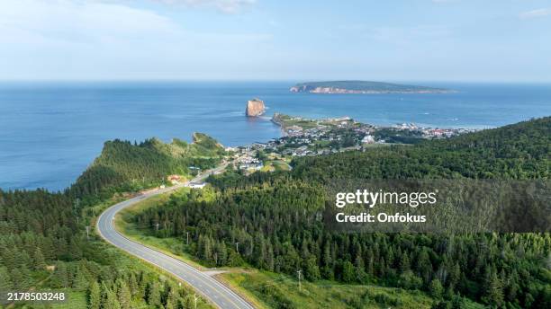aerial view of the rocher percé and the city of percé in quebec, canada - gaspe peninsula stock pictures, royalty-free photos & images