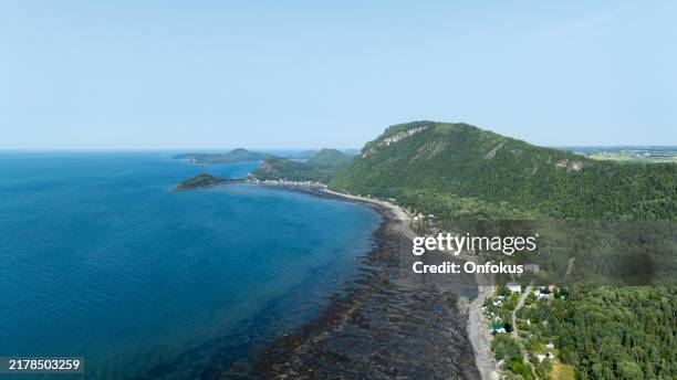 aerial view of saint-fabien-sur-mer and parc national du bic, quebec, canada during summer - st lawrence river stock pictures, royalty-free photos & images