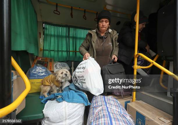 People from the Kupiansk community arrive at an evacuation point as mandatory evacuation from four communities in the Kharkiv region kicks off due to...
