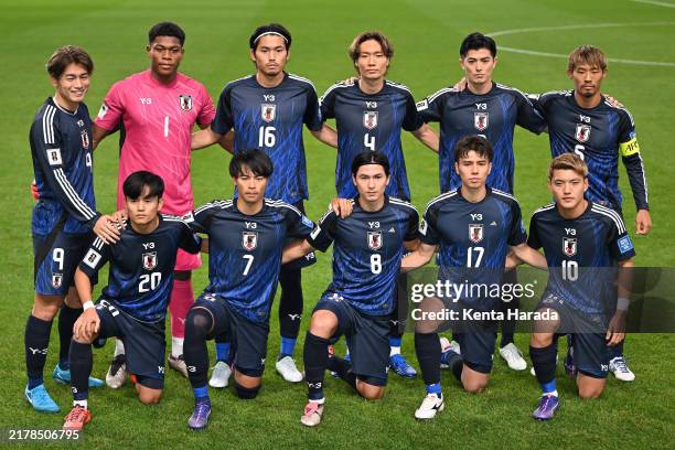 Japanese players line up for the team photos prior to the FIFA World Cup Asian Third Qualifier Group C match between Japan and Australia at Saitama...