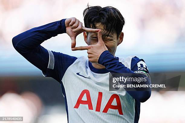 Tottenham Hotspur's South Korean striker Son Heung-Min celebrates after scoring their fourth goal during the English Premier League football match...
