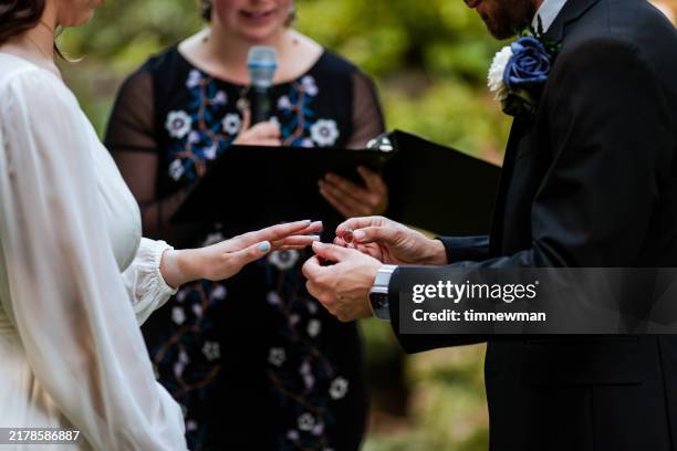 happy bride and groom on their wedding day ceremony - noivo papel em casamento imagens e fotografias de stock