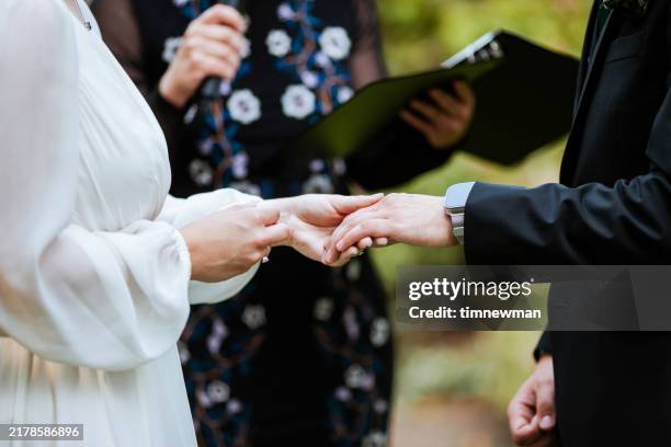 happy bride and groom on their wedding day ceremony - wedding vows stock pictures, royalty-free photos & images