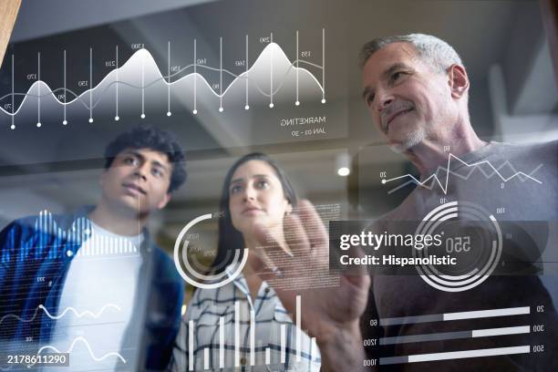businessman brainstorming with his team while creating a business plan - projection screen stock pictures, royalty-free photos & images