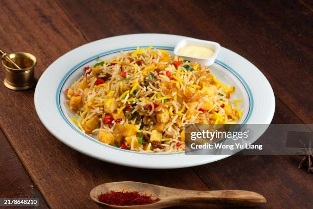 plain biryani rice (basmati rice cooked with saffron) - biryani stock pictures, royalty-free photos & images