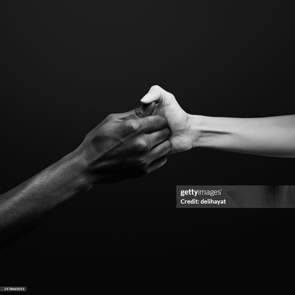 Two hands gripping for each other and play thumb wrestling. Human relations, power, unity, togetherness, symbolism concept