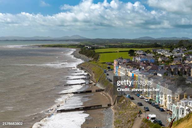multi-coloured houses lining the seafront at the seaside town of criccieth, north wales - north wales stock pictures, royalty-free photos & images