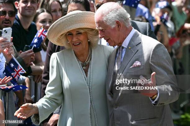 Britain's King Charles III and Queen Camilla leave after a Sunday morning service at St Thomas' Anglican Church in Sydney on October 20 during their...
