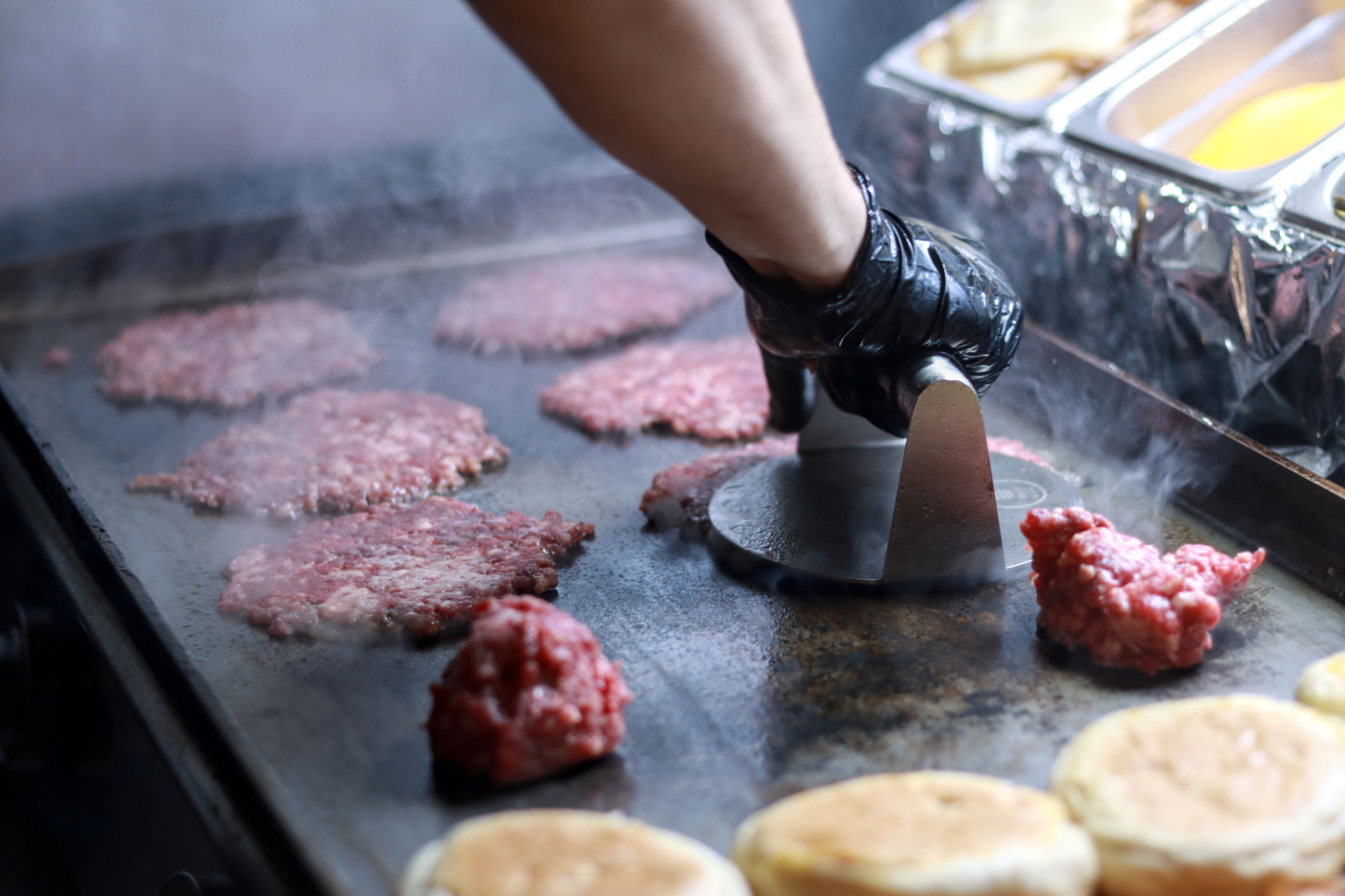 chef smashing burger