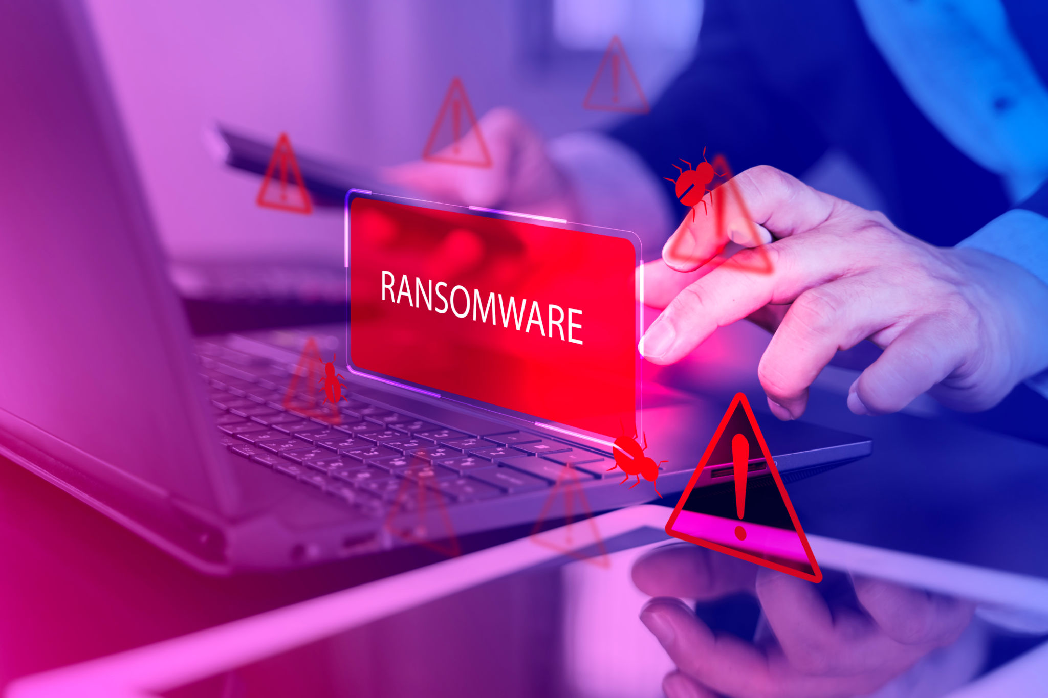 Malware attack virus alert. Person use laptop with virtual warning sign with ransomware word Malware attack virus alert. Person use laptop with virtual warning sign with ransomware word