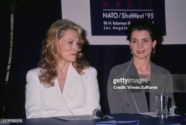 American actress Faye Dunaway and British actress Julia Ormond attend a NATO/ShoWest Convention press conference at Bally's Hotel & Casino in Las...