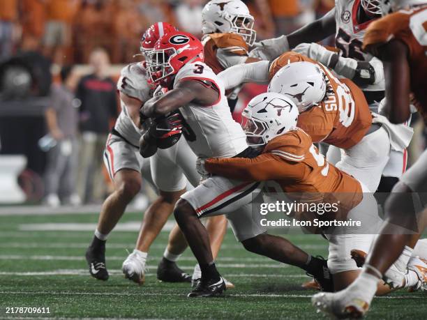 Georgia Bulldogs running back Nate Frazier rushes the ball as Texas Longhorns defensive linemen Jermayne Lole defends during the college football...