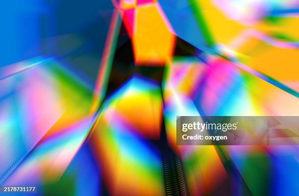 vibrant abstract art with multicolored light effects. a mesmerizing abstract artwork showcasing vibrant multicolored light effects with blurred, angular shapes in a radiant color palette, creating a futuristic and dynamic visual style. - trance stock-fotos und bilder