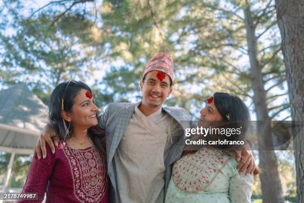 happy dashain - young nepalese americans celebrating - outdoor group photo - nepal’s most important holiday - nepal culture stock pictures, royalty-free photos & images