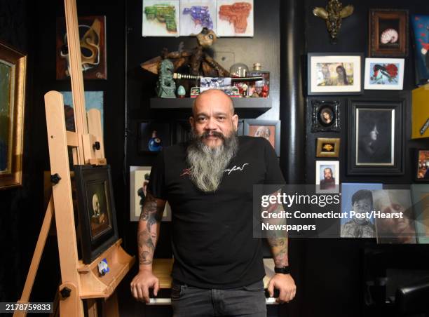 Tattoo artist Javier Eastman poses at his studio in Norwalk, Conn. Oct. 1, 2024. Hailing from Venezuela, Eastman is a tattoo artist, muralist,...