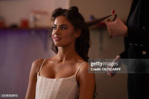 Year-old stylist Alliyah Jade, Miss Newcastle 2024, has her hair styled before a rehearsal for the Miss Great Britain 2024/25 final held at the...