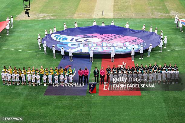 South Africa and New Zealand players line up for their national anthems before the start of the ICC Women's T20 World Cup cricket final match between...