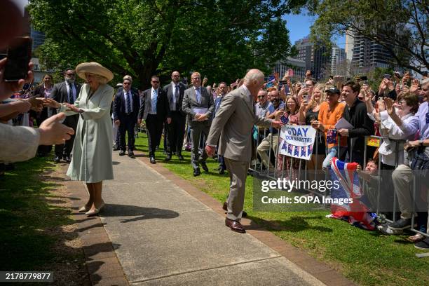 King Charles and Queen Camilla are seen greeting with the members of the public at the lawn outside St Thomas Anglican Church. King Charles and Queen...