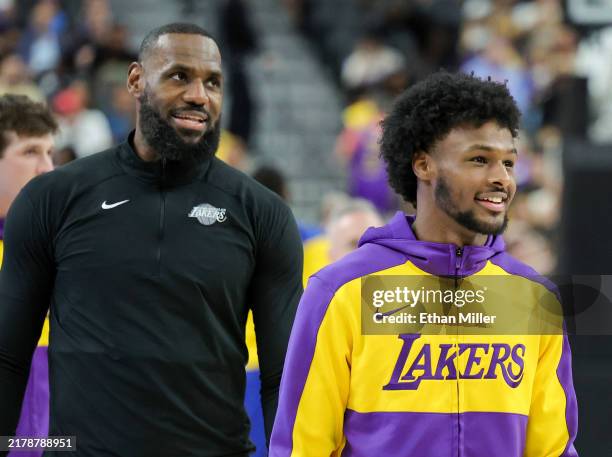 LeBron James and Bronny James of the Los Angeles Lakers warm up before a preseason game against the Golden State Warriors at T-Mobile Arena at...