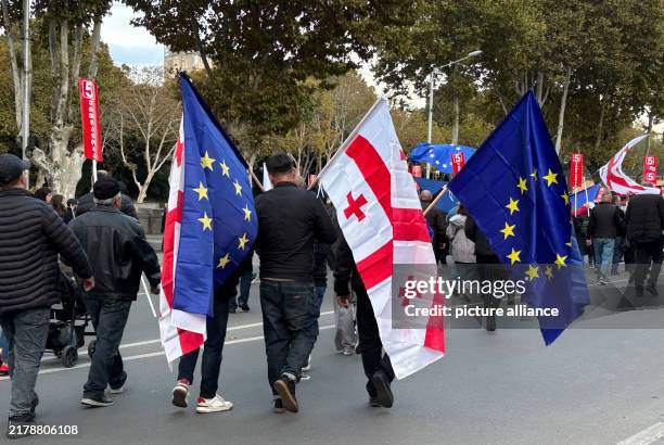 October 2024, Georgia, Tiflis: People carrying Georgian and EU flags attend a demonstration in the Georgian capital. The event, held a few days...
