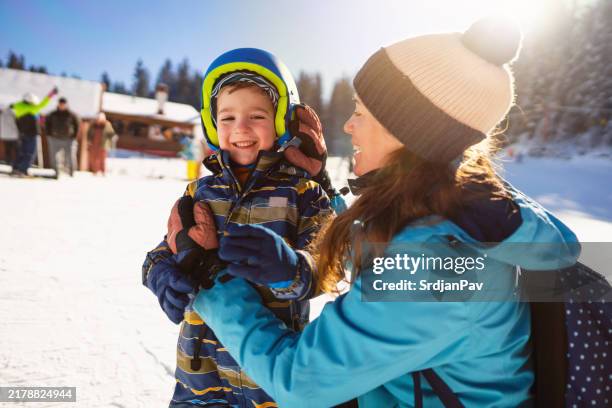 mom and son on a ski vacation - family skiing stock pictures, royalty-free photos & images
