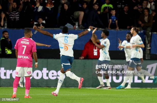 Marseille's players celebrate after scoring their team's first goal during the French L1 football match between Montpellier Herault SC and Marseille...