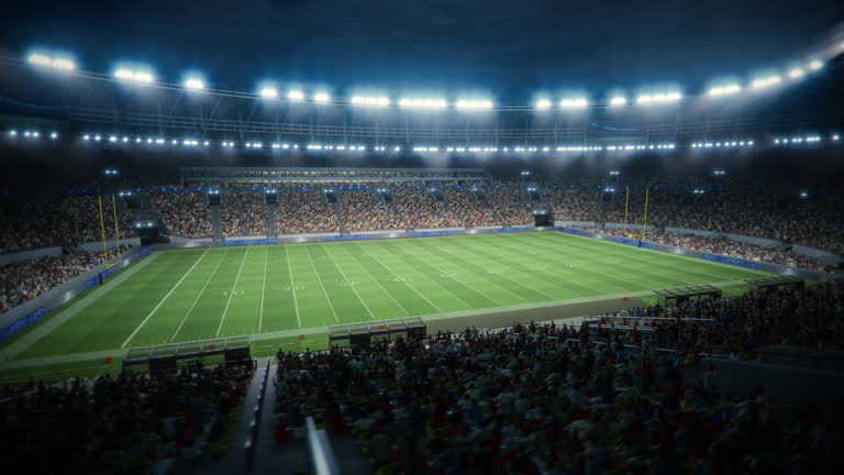 https://media.gettyimages.com/id/2178927204/video/night-aerial-view-of-a-crowded-american-football-stadium-fans-fill-the-stands-and-the-field.jpg?b=1&s=640x640&k=20&c=p_izYdaBHl59ut6rwH2BQ1F_mi4fsh1x9VSN4XbzxGE=