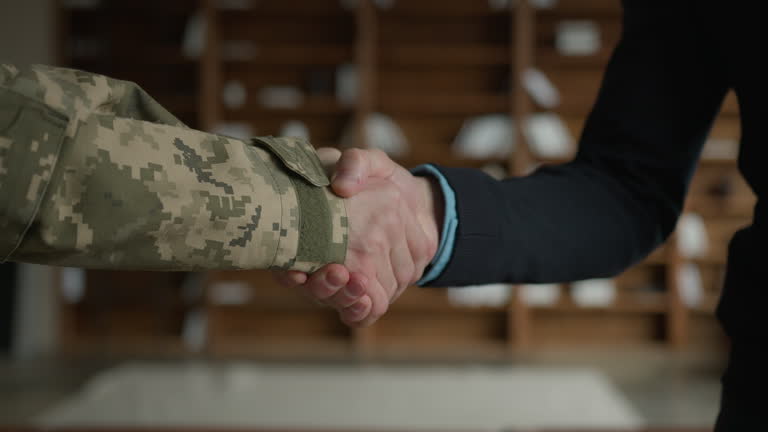 https://media.gettyimages.com/id/2178944383/video/close-up-male-handshaking-two-unrecognizable-men-military-soldier-veteran-warrior-guy-veteran.jpg?b=1&s=640x640&k=20&c=ON45NXz9NaG28BafEhNMlSNcCklLJhjhpwPon7b2Q48=