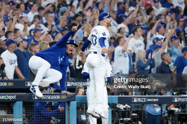 Kevin Kiermaier of the Los Angeles Dodger and Brusdar Graterol celebrate a two-run home run by Will Smith during the third inning in game six of the...