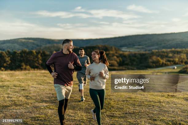 freedom while running - hill stock pictures, royalty-free photos & images