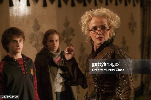 Actors, Daniel Radcliffe, Emma Watson and Miranda Richardson on the set of the film, 'Harry Potter and The Goblet of Fire', London, England, 2004