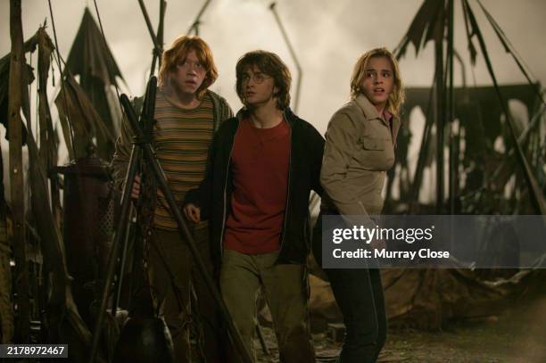 Actors, Rupert Grint Daniel Radcliffe and Emma Watson on the set of the film, 'Harry Potter and The Goblet of Fire', London, England, 2004
