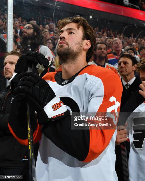 Ryan Poehling of the Philadelphia Flyers stands for the playing of the national anthem prior to the game against the Edmonton Oilers at Rogers Place...