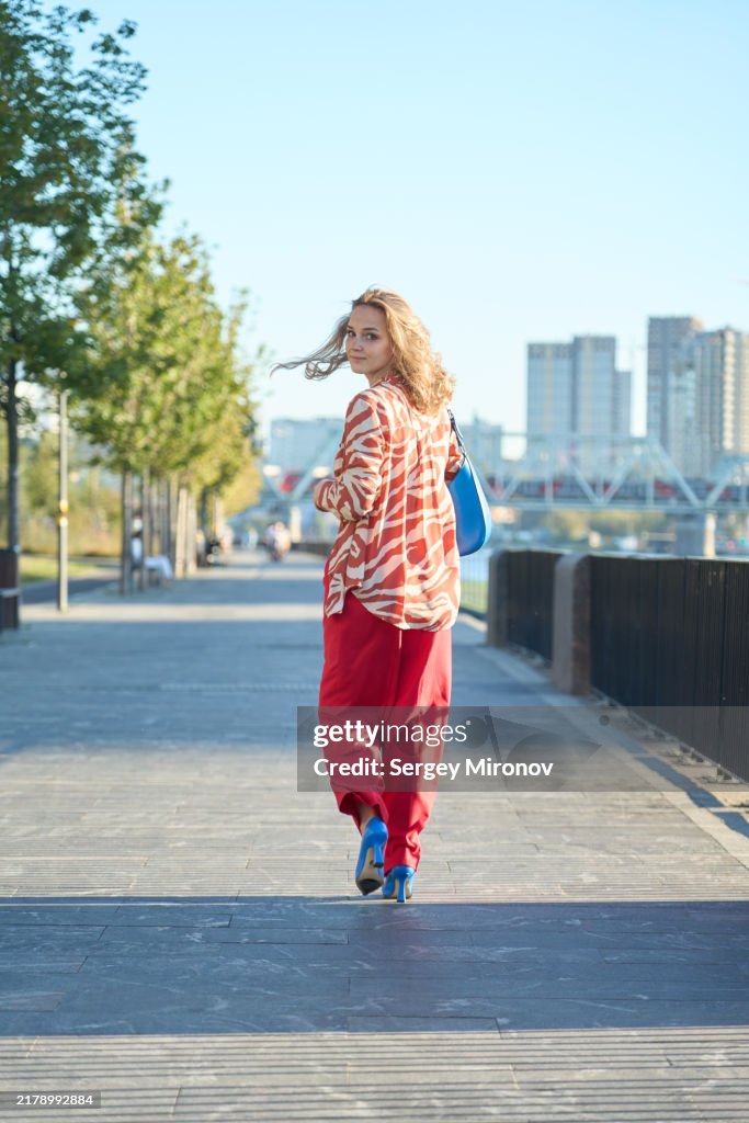 Woman walking with a smile