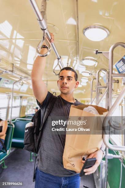 man using public transportation - trolley bus stock pictures, royalty-free photos & images