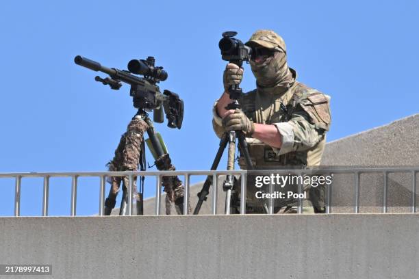 Snipers from the Australian Defence Force are seen prior to King Charles III and Queen Camilla's visit to the Parliament House on October 21 in...