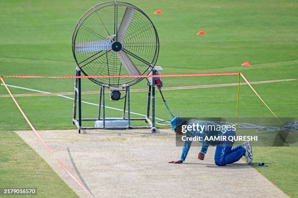 Pakistan's Noman Ali inspects the pitch during a practice session ahead of their third and last Test cricket match against England at the Rawalpindi...