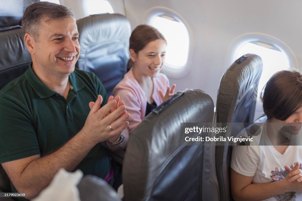 People clapping hands to a pilot after landing the plane