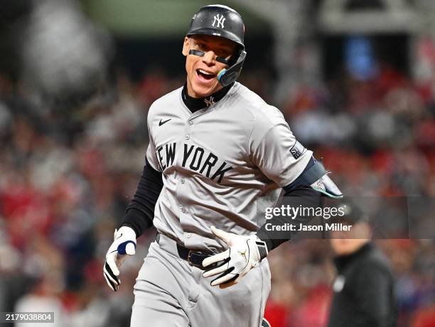 Aaron Judge of the New York Yankees celebrates after a two run home run during the eighth inning against the Cleveland Guardians during Game Three of...