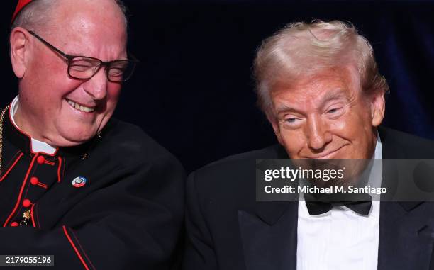 Cardinal Timothy Dolan and Republican presidential nominee, former U.S. President Donald Trump react during the annual Alfred E. Smith Foundation...