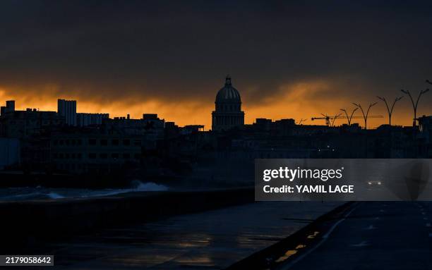 View of the city at dawn during the fourth day of a massive power outage in Havana on October 21, 2024. Electricity has been restored to half of...