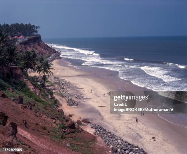 varkala beach slanting to arabian sea, kerala, india, asia - varkala stock illustrations
