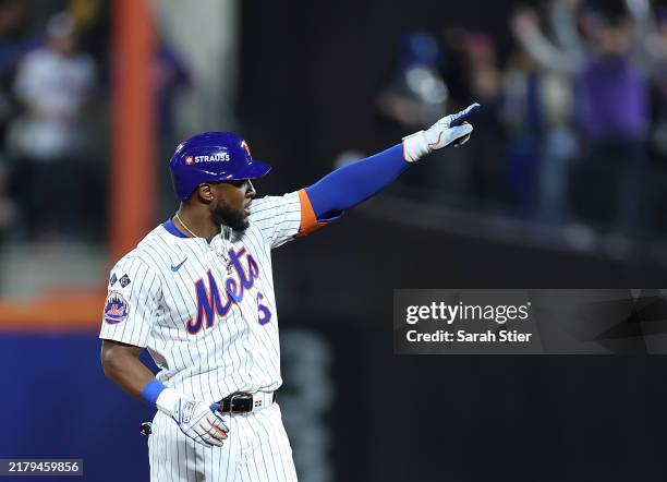 Starling Marte of the New York Mets reacts after hitting a double in the sixth inning against the Los Angeles Dodgers during Game Five of the...
