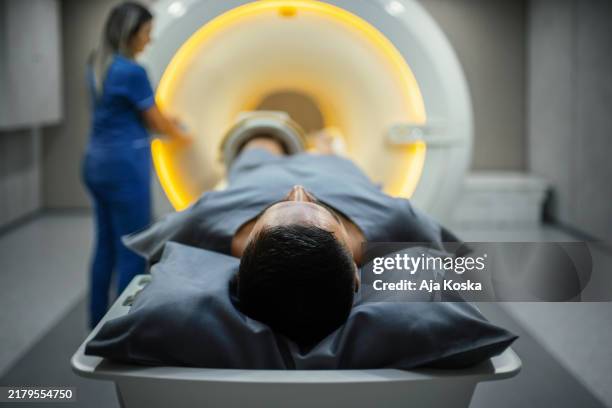 starting the scan. - mri scan stock pictures, royalty-free photos & images